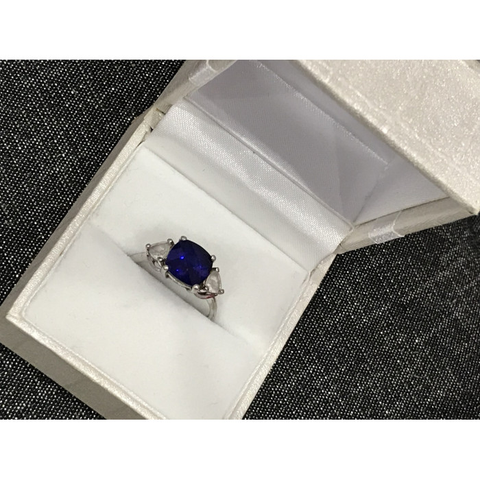 Sky Jewelry Серебряное кольцо с синим топазом и фианитами